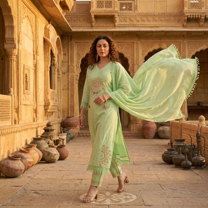 Mint green mandala embroidered cotton kurta set with crochet lace dupatta flowing in breeze, palace courtyard with terracotta pots - Jagranee