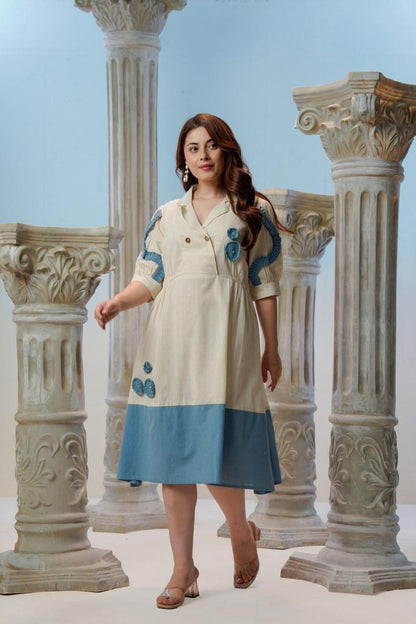 Ivory Cotton Linen Midi Dress with Blue Crochet Appliqué — 
Elegant Walking Pose Showing Full Flare — Jagranee Jaipur