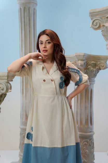 Upper Body Portrait of Ivory Midi Dress with Blue Crochet Rosette 
Appliqué and Pleated Sleeve Trim — Jagranee Jaipur