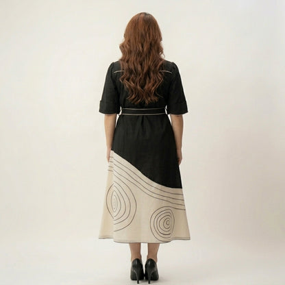 Back View of Black Ivory Colour Block Midi Dress Showing Tie 
Belt Bow and Spiral Print Ivory Skirt Panel — Jagranee Jaipur