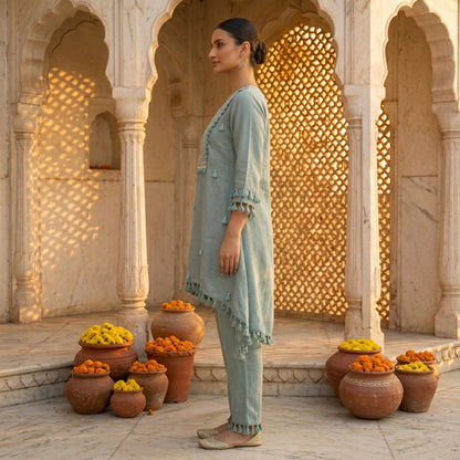 Side Profile of Teal Cotton Linen Co-ord Set Showing Asymmetric 
Kurta Silhouette and Tassel Fringe Detail — Jagranee Jaipur