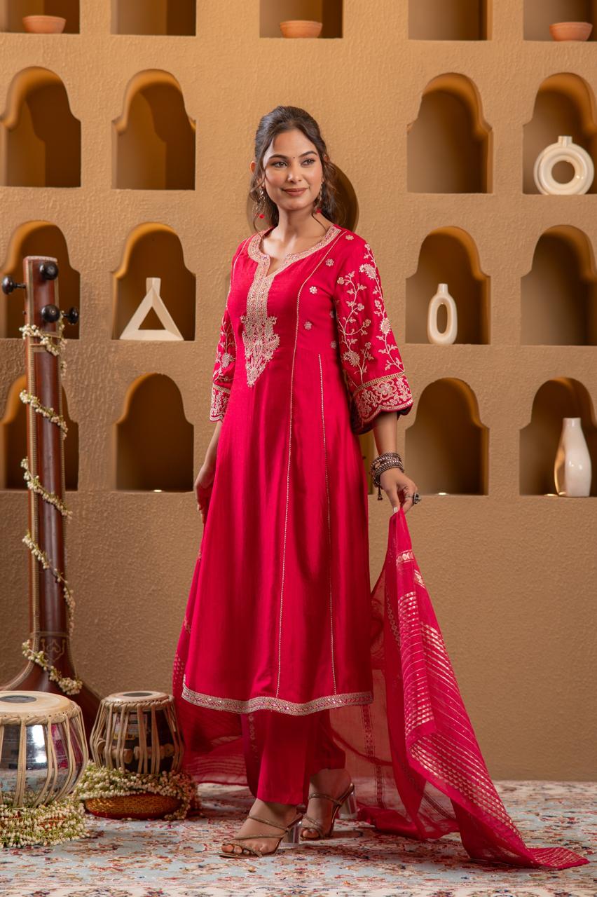 Woman wearing rani pink Viscose Silk Anarkali kurta set with gold paisley yoke embroidery, front facing with dupatta flowing - Jagranee