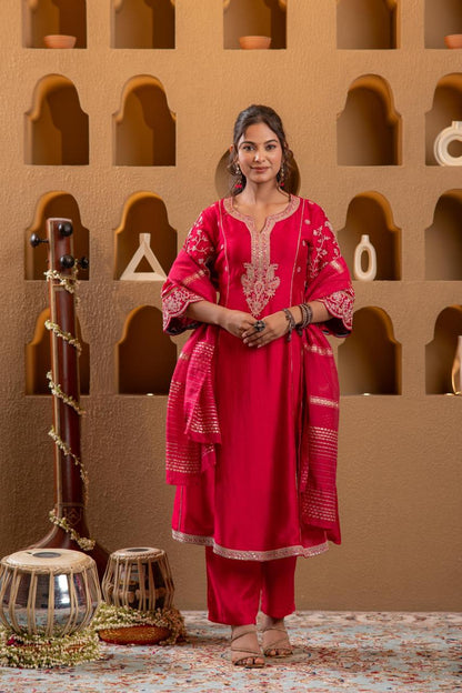 Front facing pose of rani pink Viscose Silk kurta set with gold paisley embroidery and zari dupatta, warm studio lighting - Jagranee