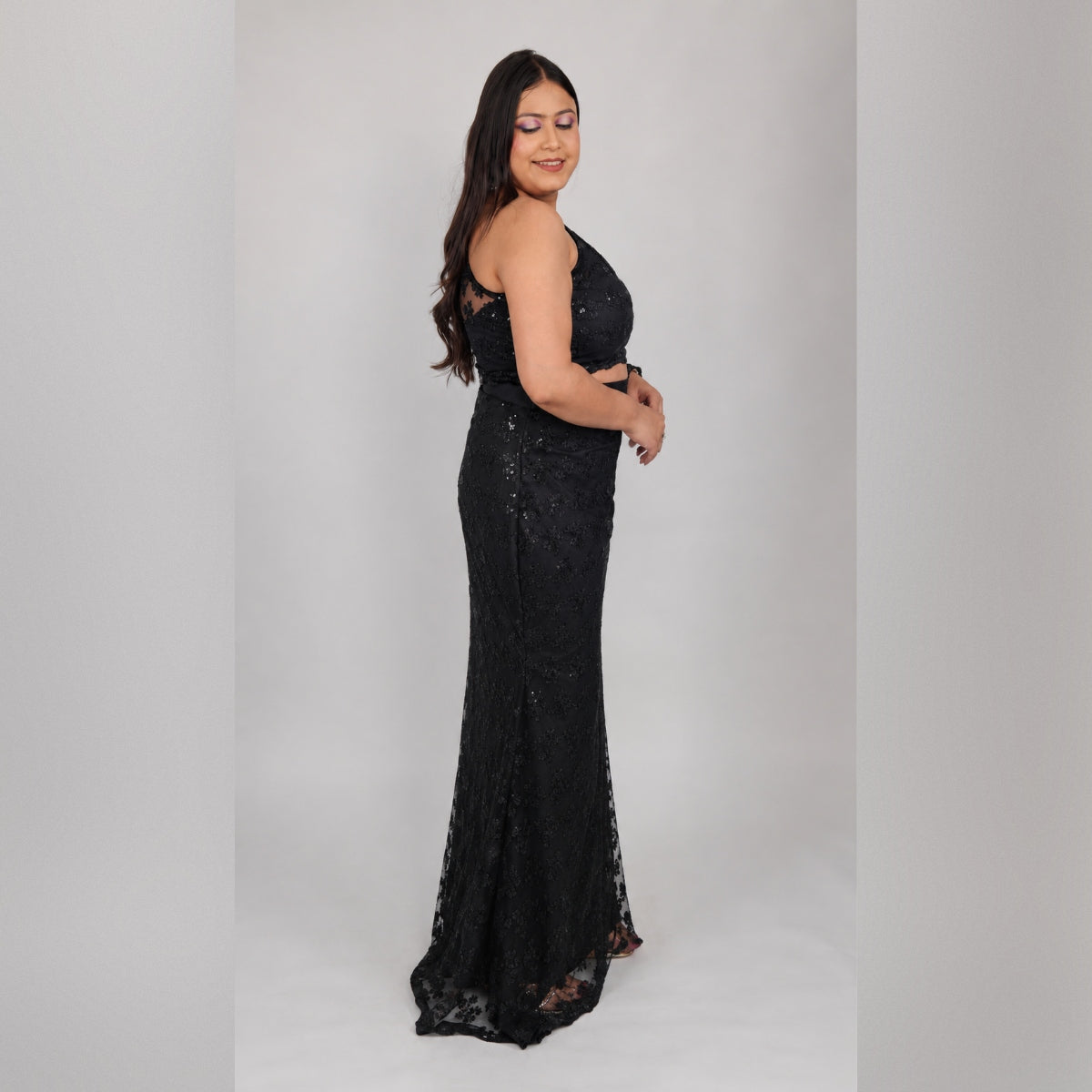 Side view of black sequin net mermaid saree gown showing fitted silhouette and spaghetti strap crop top - Jagranee