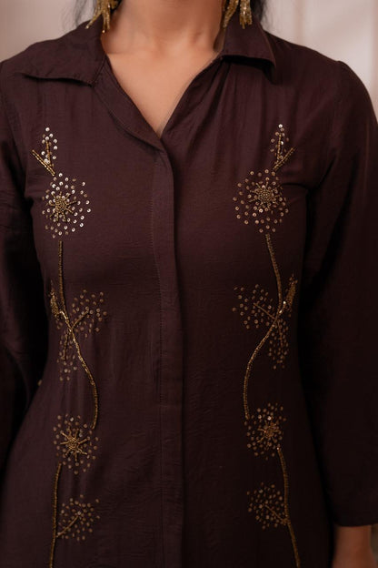 Close-up detail of gold sequin dandelion starburst embroidery on dark brown crepe kurta with collar neckline - Jagranee