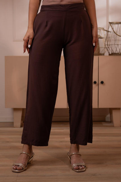 Close-up of dark brown crepe wide-leg palazzo pants with clean pleated front and elasticated waist - Jagranee