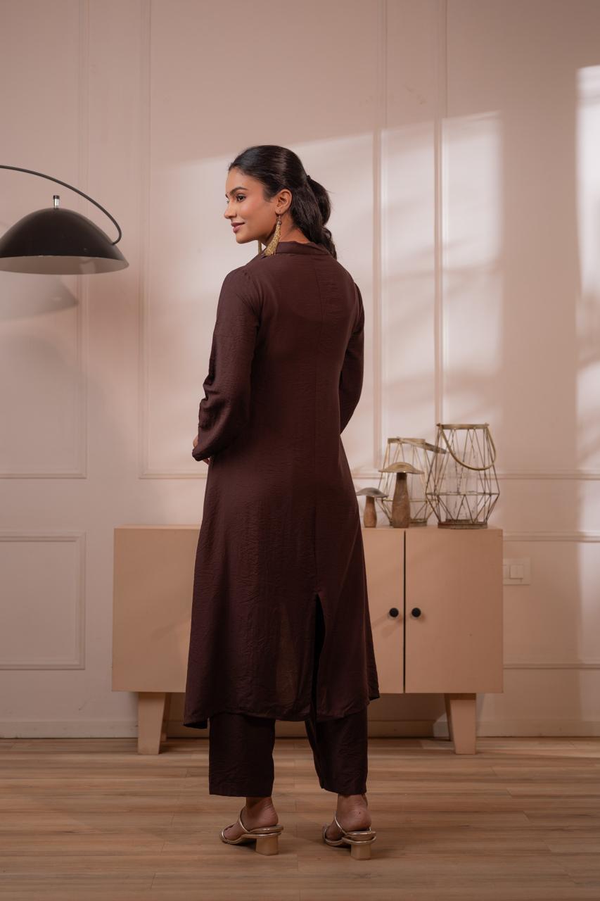 Back view of dark brown crepe high-low kurta showing asymmetric hemline and clean back silhouette with palazzo pants - Jagranee