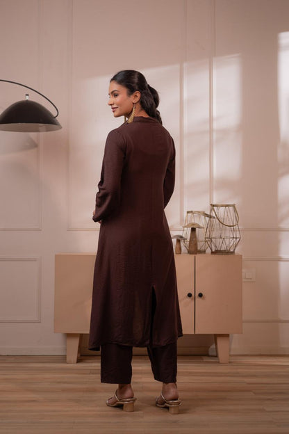 Back view of dark brown crepe high-low kurta showing asymmetric hemline and clean back silhouette with palazzo pants - Jagranee