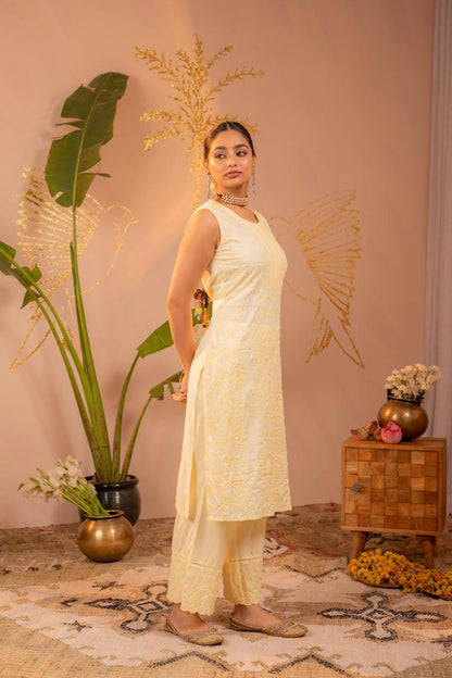 Side profile of lemon yellow chikankari sleeveless kurta set showing all-over floral embroidery - Jagranee